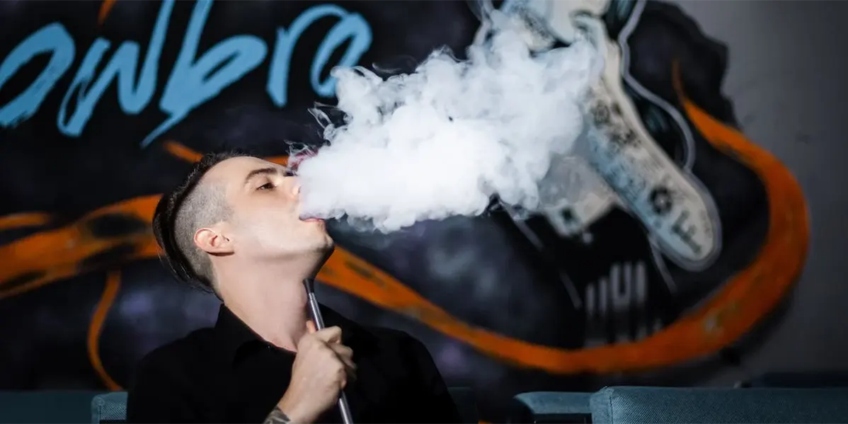 Ultimate Guide to Charging Your Vape Pen 2023 Man enjoy the vape puff