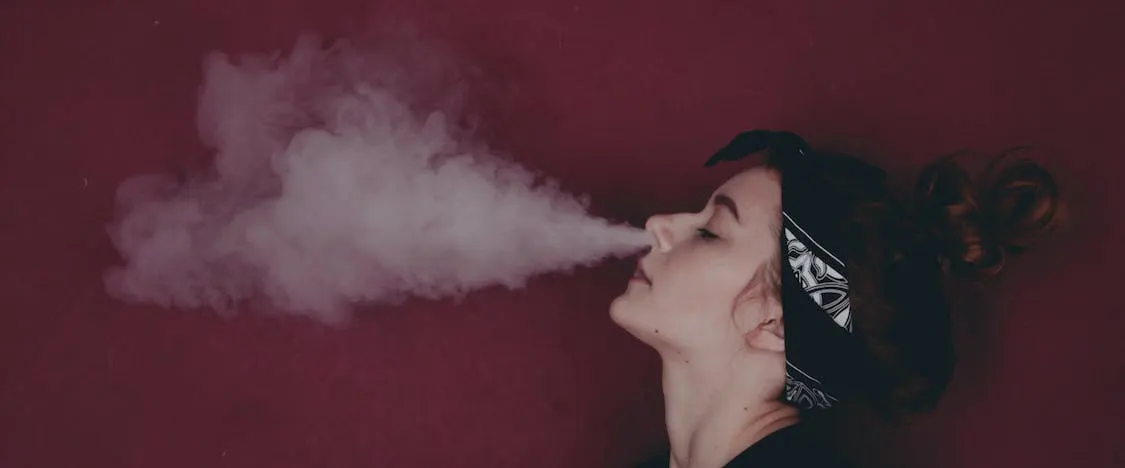 Ultimate Guide to Charging Your Vape Pen 2023 Woman enjoy the vape puff
