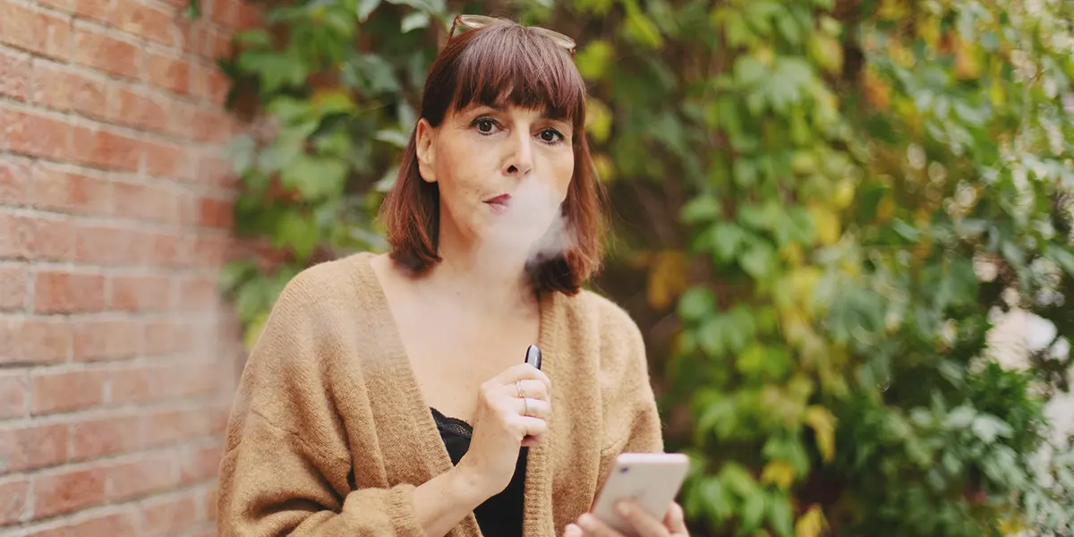 How to Store Disposable Vapes for Optimal Enjoyment lady is vaping outsite