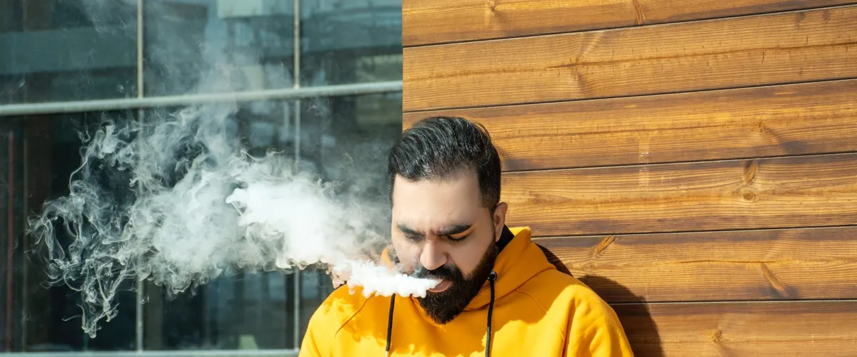 How to Store Disposable Vapes for Optimal Enjoyment man enjoys his vaping while work break