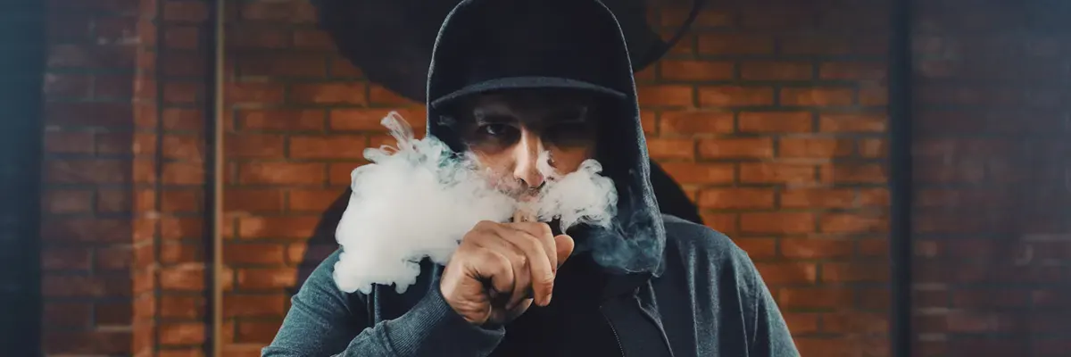 Inside Vape Pod Systems: How Vape Pods Work man vaping electronic cigarette silently