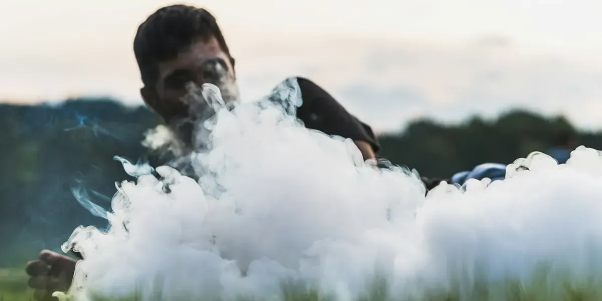 Inside Vape Pod Systems: How Vape Pods Work cool man vaping outside
