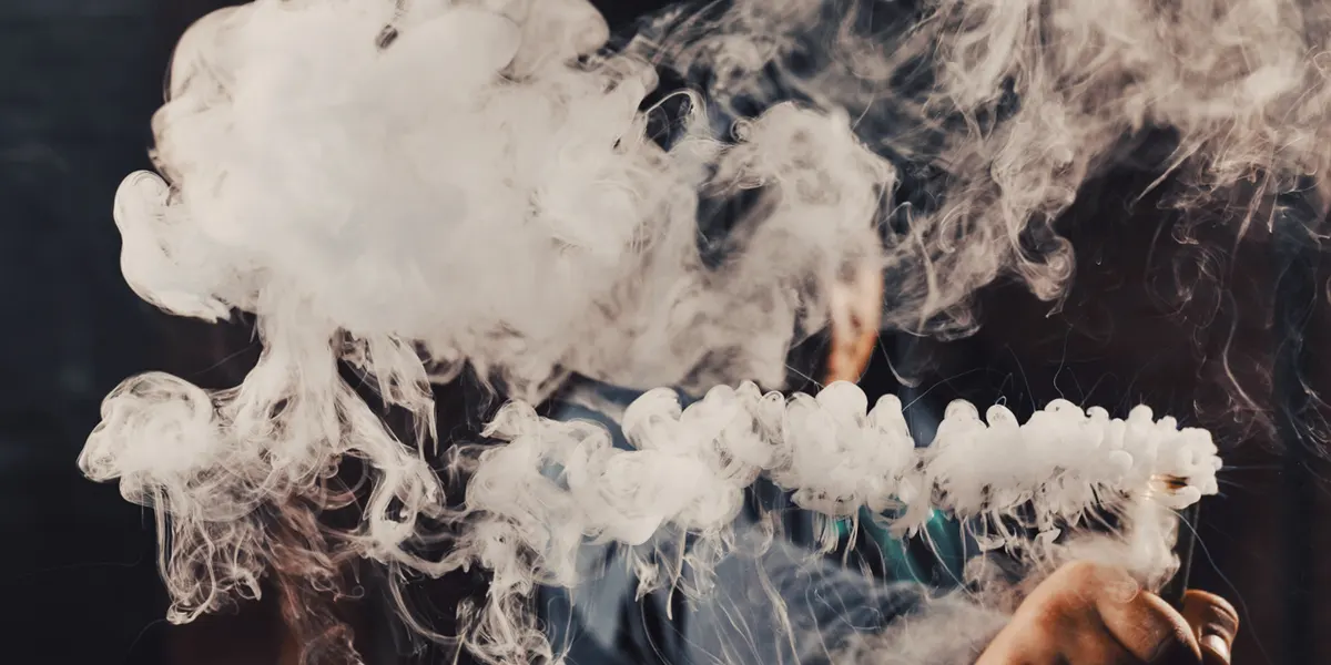 man vaping large puff after unclog his favorate disposable vape