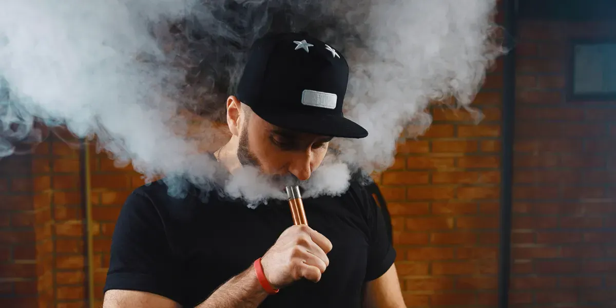 How to Tell When A Vape Coil is Bad: A Comprehensive Guide man vaping electronic cigarette with a properly functioning vape coil