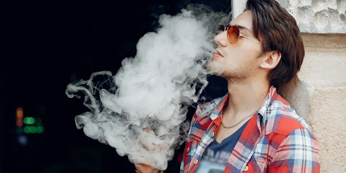 What Does Atomizer Mean on a Vape? stylish man enjoys his vapor using his favorite disposable vape