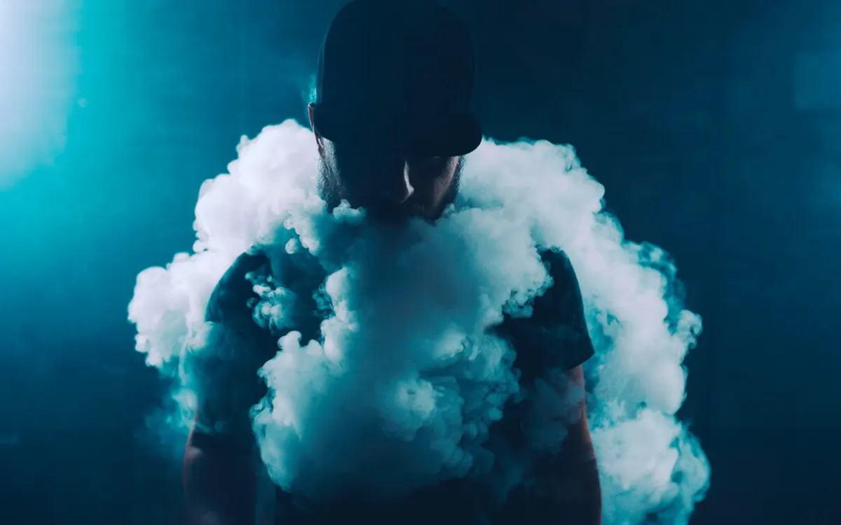 man vaping electronic cigarette for a enjoyable vaping experience