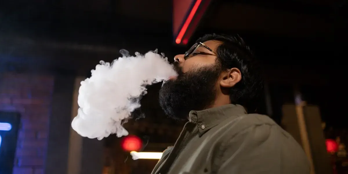 Why is My Disposable Vape Auto-Firing? man relaxing by vaping from disposable vape